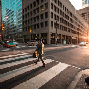 man crossing pedestrian lane