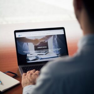 man operating the MacBook Pro