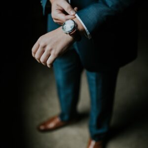 man holding his black suit