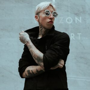 man in black jacket wearing eyeglasses